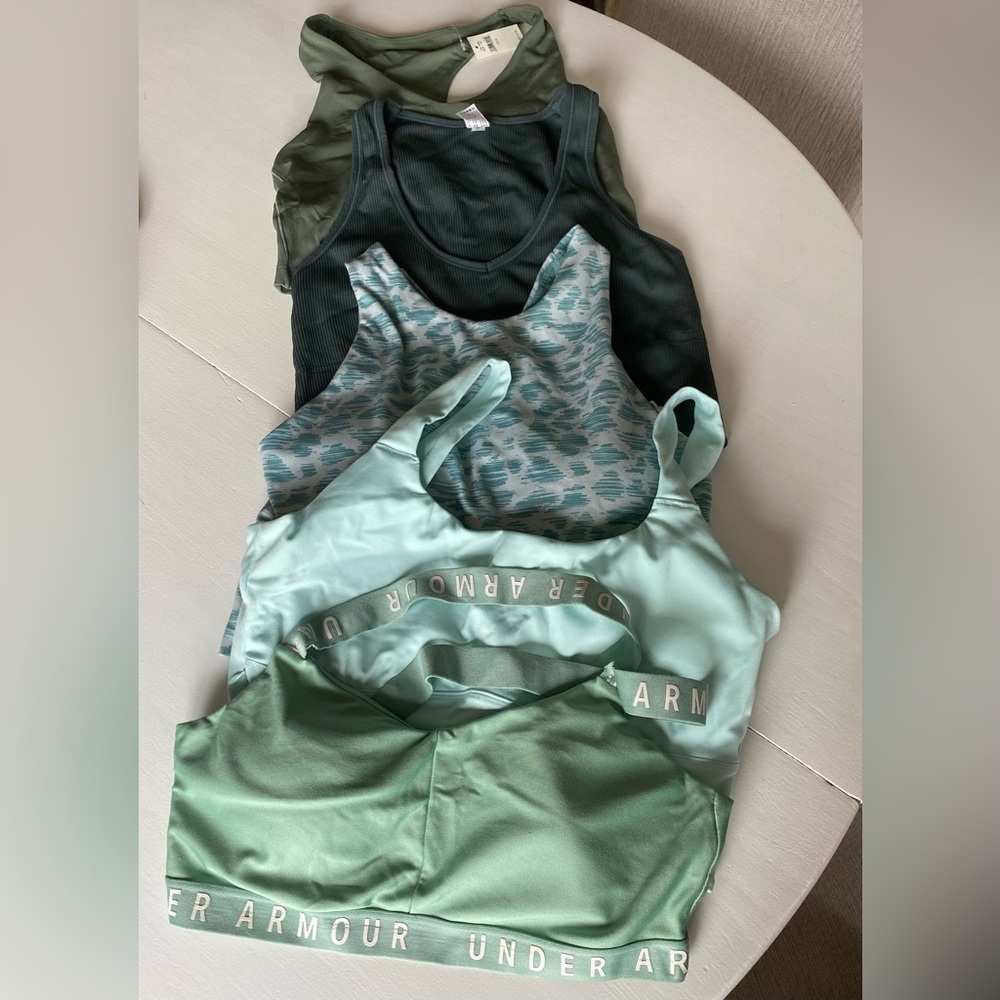 Five medium green sports bras